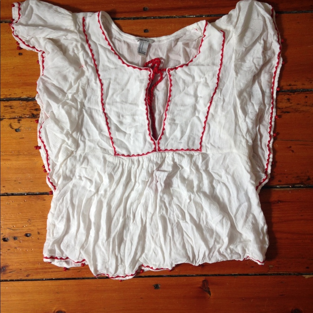 White tasseled shirt